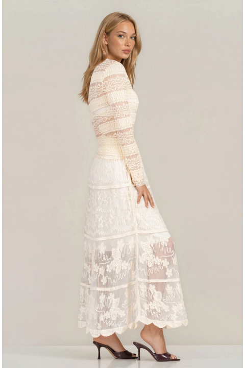Дълга пола в цвят екрю с релефна бродерия и къса подплата